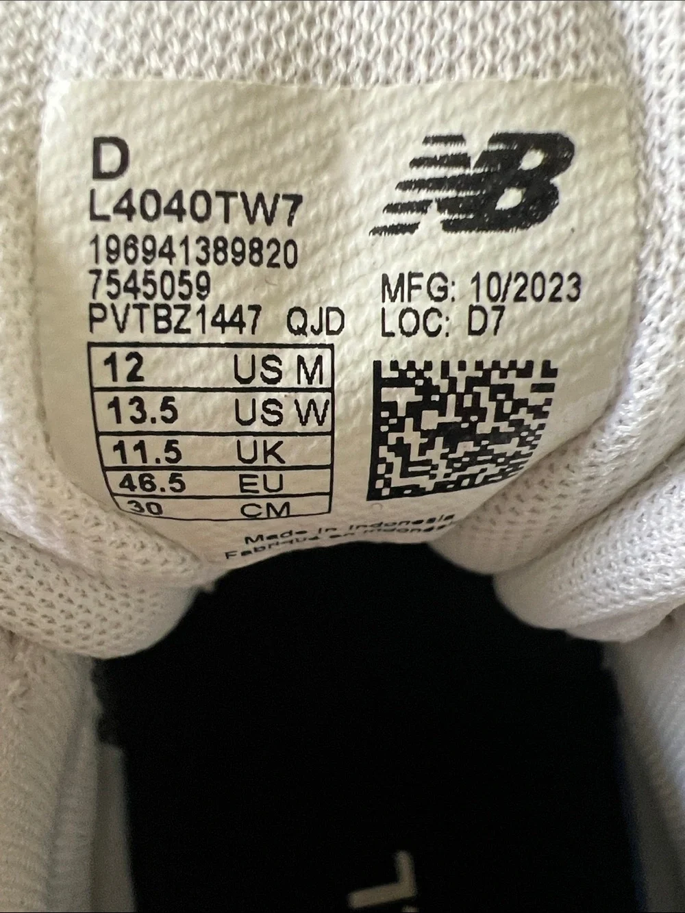 New Balance White Baseball Cleats with Black Logo